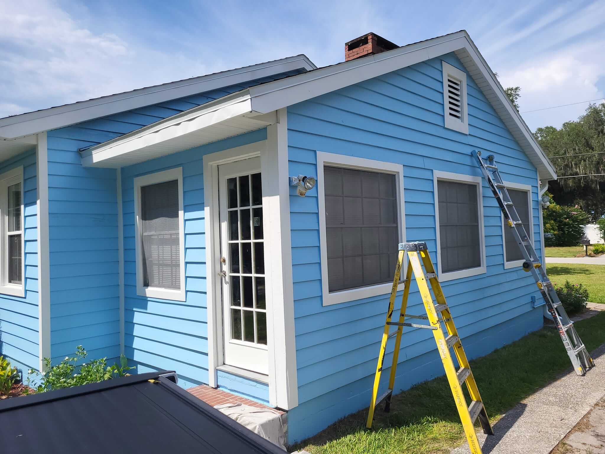 Blue house exterior repaint, side view